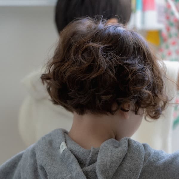 A happy child relaxing comfortably